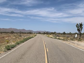 Empty road along landscape