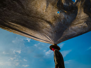 Low angle view of balloons against blue sky