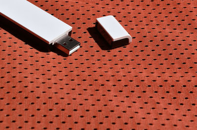 Close-up of usb stick on fabric