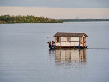 Boat in lake against sky