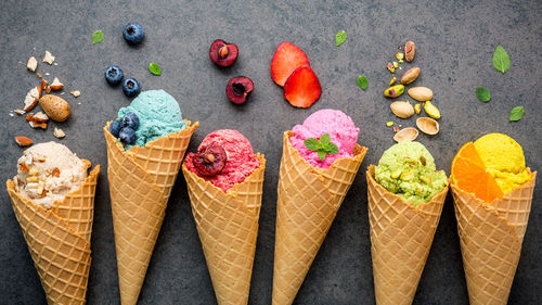 Directly above shot of ice creams and fruits