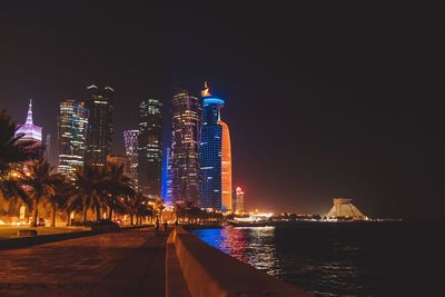 Illuminated buildings in city at night