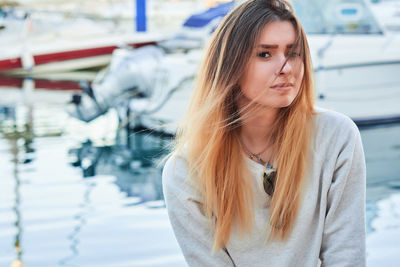 Portrait of young woman in car