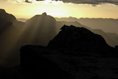 Scenic view of rocky mountains against sky during sunset