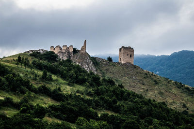 Historic building against cloudy sky