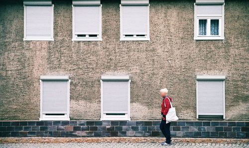 Man standing in front of building