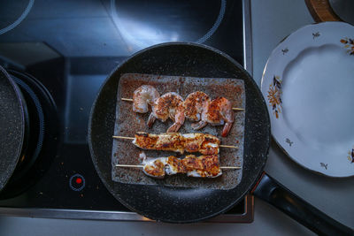 High angle view of meat in cooking pan