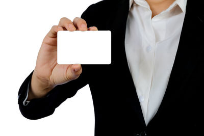 Midsection of person holding text against white background