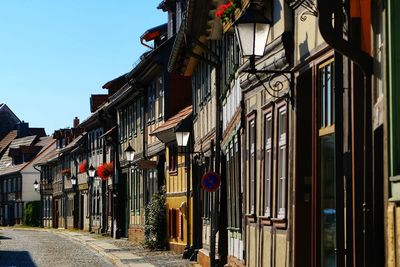 Street amidst buildings against sky