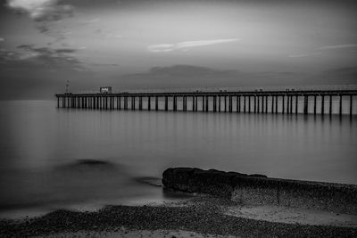 Pier over sea against sky