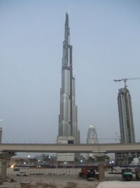 View of city buildings against clear sky