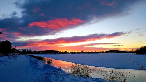 Scenic view of lake against sky during sunset