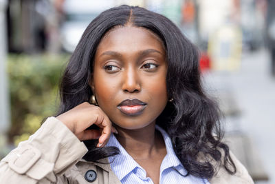 Close-up of young woman looking away