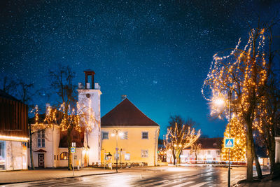 Buildings in city at night