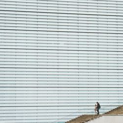 Woman standing by railing