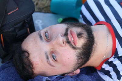 Portrait of young man lying down