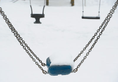 Low angle view of chain against clear sky