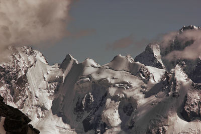 Snow covered mountains against sky