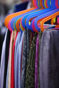Close-up of clothes hanging on coathangers for sale