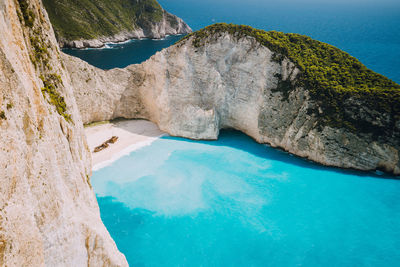 Scenic view of sea seen through rocks