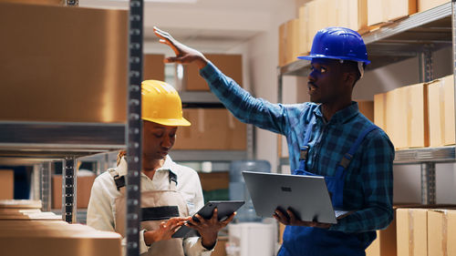 Rear view of engineer working in factory