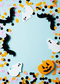 High angle view of multi colored umbrellas on blue background