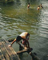 High angle view of men swimming in lake