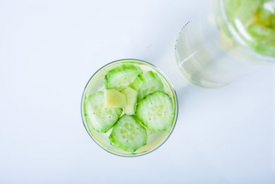 Close-up of drink on table against white background