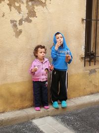 Full length of girl standing outdoors