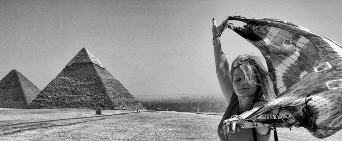 Panoramic view of woman holding sarong against pyramid of khafre