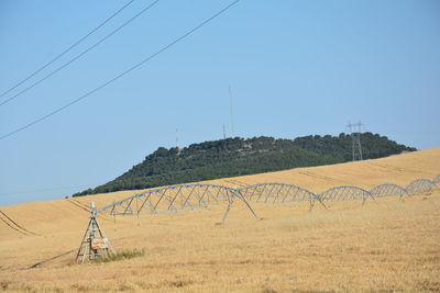 Scenic view of mountains against clear blue sky