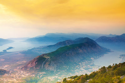 Scenic view of mountains against cloudy sky