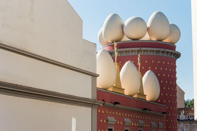 Low angle view of text on building against sky