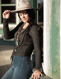 Woman wearing hat while standing outdoors