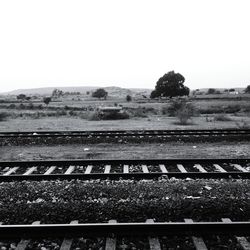 Railroad tracks against clear sky