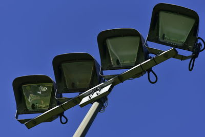 Low angle view of road against clear blue sky