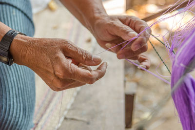 Cropped image of worker working in factory