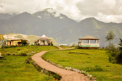 House on mountain against sky