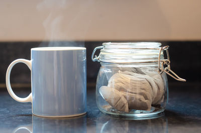 Close-up of coffee in jar on table
