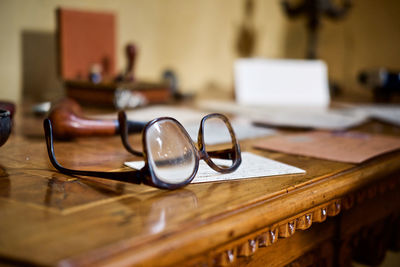 Close-up of eyeglasses on table