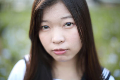 Portrait of beautiful woman standing outdoors