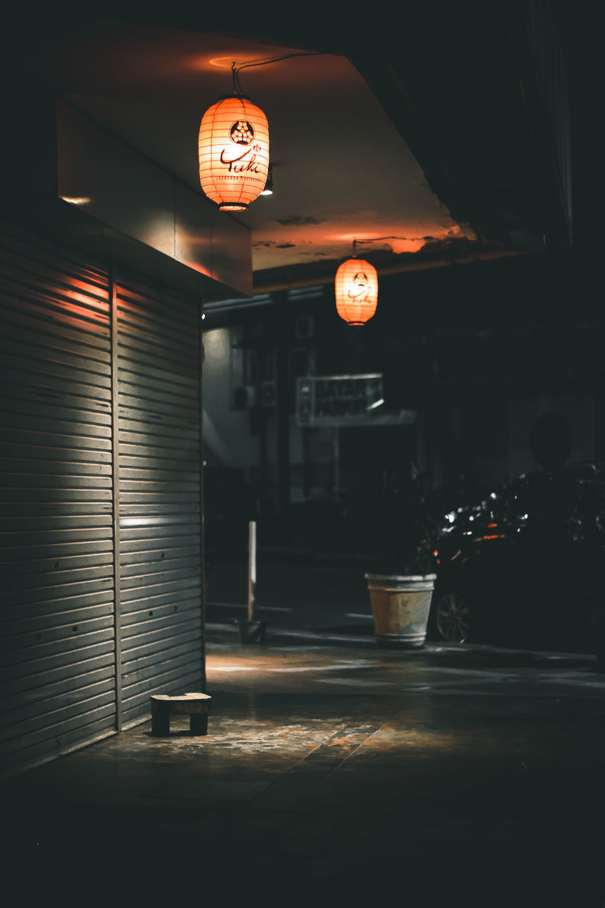 ILLUMINATED LANTERNS AT NIGHT