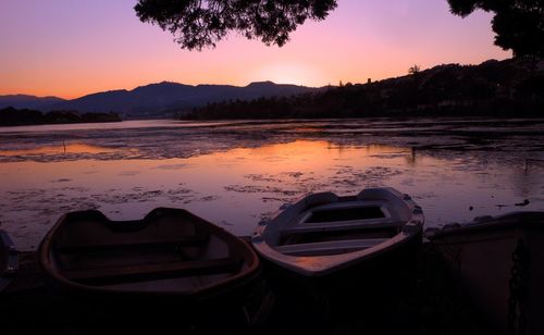 Scenic view of lake against sky during sunset