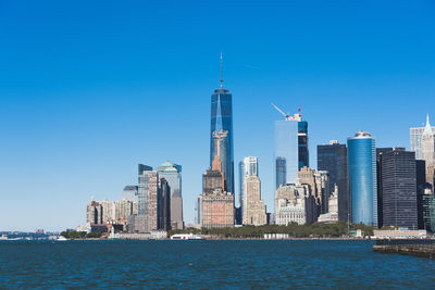 View of cityscape against blue sky