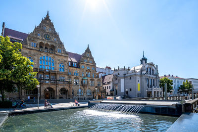 View of buildings against sky in city