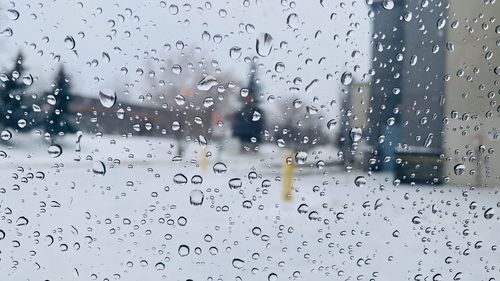 Raindrops on glass window during rainy season