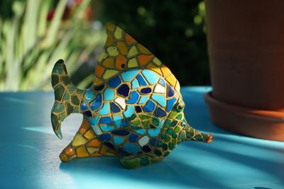 Close-up of two birds on table