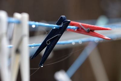 Close-up of clothespins on clothesline