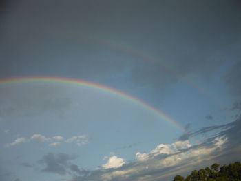 Low angle view of rainbow in sky