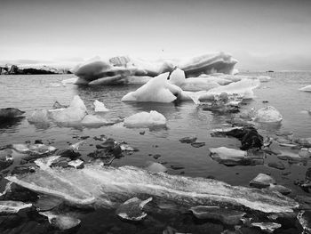 View of frozen sea against sky during winter